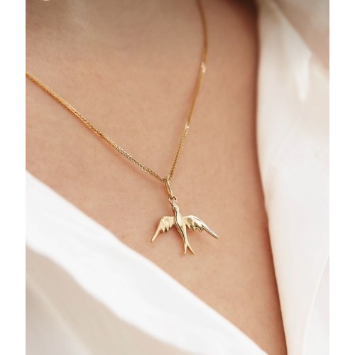 Charm Rondine in Oro giallo 18 kt