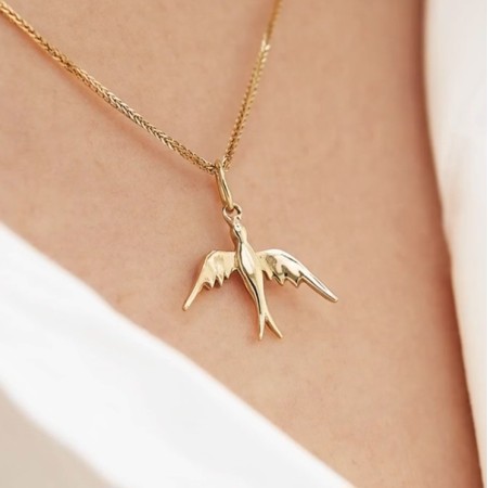 Charm Rondine in Oro giallo 18 kt